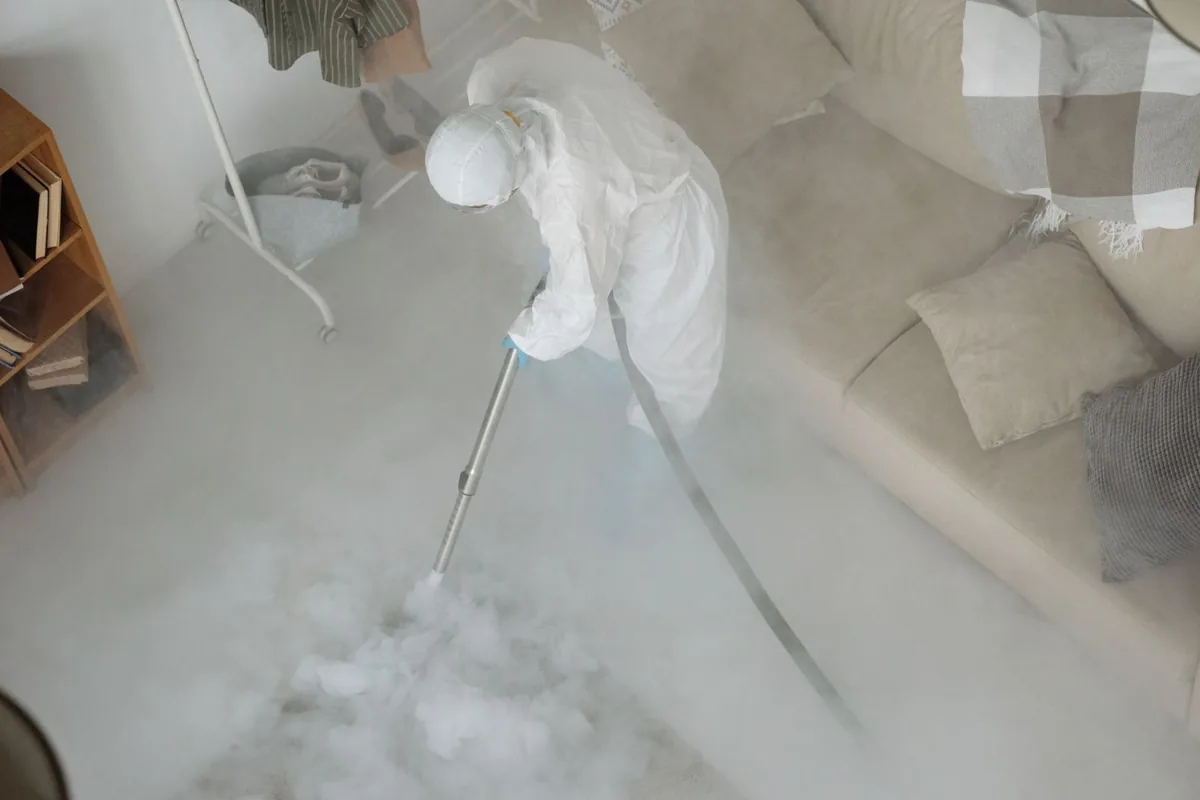 Biohazard cleanup technician in protective equipment, Winchester, MA
